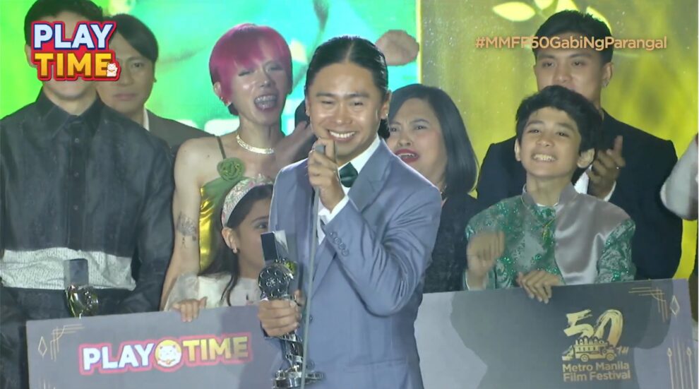 Zig Dulay receiving the award for Best Movie at the 2024 MMFF