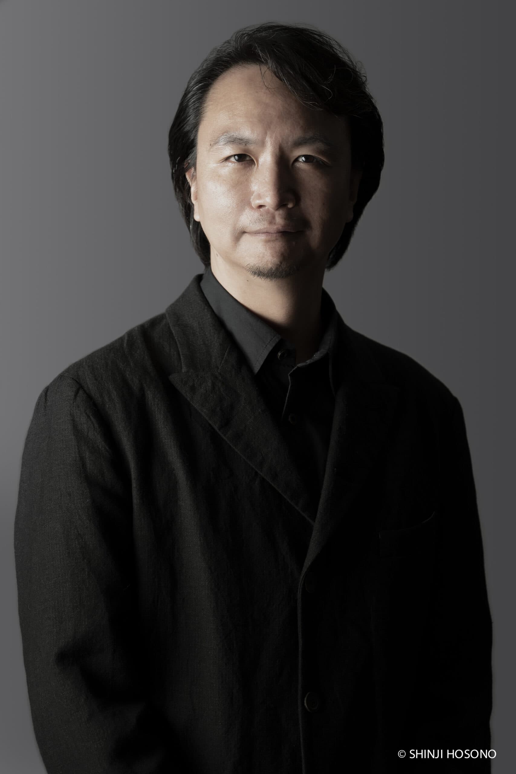 Keishi Nagatsuka is the current Artistic Director of KAAT Kanagawa Arts Theatre, a prominent performing arts venue in Yokohama, Japan. He has made significant contributions to the Japanese theater scene, curating, overseeing, and launching a wide range of performances. Under his direction, KAAT has become known for its innovative programming, including contemporary theater, international collaborations (recently 'Confessions of a Shinagawa Monkey', 'Shut Up Womb' in December 2024), and a focus on both established and emerging artists. In 1996, he launched the theatre production unit Asagaya Spiders. Their plays: 'DOGDAYS' (2000/2006), 'Working Men' (2004/2016), 'Sakurahime' (2011), 'Ageing and Architecture' (2021) have been known for their distinctive focus on narrative and deep exploration of human relationships and challenging traditional narrative structures. Currently he is active as a playwright, director and actor. His recent productions in KAAT are: 'Chikamatsu Love Suicides' (2021), 'Women of the Night' (2022) and the latest work ‘The Flower and the Dragon’ (2025). In the film industry circuit, he is known for his roles in: 'tokyo.sora' (2002), 'Realism no Yado' (2003), 'Hanagatami' (2017), 'Shin Ultraman' (2022). His father is the prominent actor Kyozo Nagatsuka. You've been serving as the third artistic director of the arts theater for about four years now, but specifically, what was the background behind becoming the artistic director of KAAT Kanagawa Arts Theatre Theater? As far as I know, you are one of the youngest among the artistic directors in Japan, which I find truly impressive. My relationship with this theater is extensive. The theater opened in 2011, and in its very first program that year, I performed a piece called ‘Buoy’ by Juro Miyoshi in the large studio. In a way, I was one of the first artists to use this theater, right from its inception. Since then, I have worked at this theater, especially on solo projects, the Kuzukawa Shichosha, which presented many works by Juro Miyoshi. Later, when Akira Shirai became the Artistic Director, I have had the opportunity to direct a variety of works, which includes works by Pirandello, Arthur Miller and Matsuyo Akimoto, and even to write scripts for some of Shirai’s productions, based on Ray Bradbury and Strindberg’s novels. These experiences were valuable for me. Not only did I gain the opportunities to encounter and direct new works that I had never come across before, but I was also able to be involved in writing scripts, which contributed to my accumulated experience. In addition, I was able to discuss the incorporation of new creative processes. Because of these kinds of various relationships, I myself had many opportunities to talk with former artistic director Akira Shirai and the theatre staffs about the theatre itself, and I think that may have been one of the reasons I was asked to become an artistic director. I must admit that I visit KAAT and attend various theater performances, but in these four years, I feel that a lot has changed, and there are two major innovations. One is that, undoubtedly, KAAT has become a bridge between the West and the East, and the other is that the surrounding area, or—so to speak—the town itself has become more integrated with the theater. Was it your time in London that pushed you toward Europe? I’m not sure exactly how much influence European theater has had on me, but I did have significant experience. Specifically, I spent about three months training and observing at the National Theatre’s research and development center, ‘Studio’. In Japan, rehearsals typically last 40 or 50 days, and once the first day of the performance begins, the production runs until the final show and then ends. That’s fine, but I found myself becoming more and more interested in whether it would be possible to spend more time on the creative process and to nurture the finished work for a longer period of time. This idea was a significant discovery for me as a creator. I thought that Japanese theatres, for example, national ones like the National Theatre, should be more proactive in taking the time for such creative processes. When I returned to Japan, I began to believe there should be more support for the arts from various levels of government, both national and local. I started reaching out more actively, meeting with producers from the National Theatre and the Setagaya Public Theatre, urging them to support workshops and create new works. I also advocated them to produce works aimed at children. I came to understand that we, as creators and professionals in this field, should be more conscious of the importance of public institutions producing theater. We, as professionals, must be aware of our responsibility to ensure that not only the audience, but also people in the community should certainly have access to theater. This is something I’ve thought a lot about since then. There is a long-standing debate on nature versus nurture. I would like to ask about your upbringing. I presume, your father must have been an indisputable inspiration. I think it’s quite significant. I have had many opportunities to watch films. I started watching movies around the age of three. Since my parents were separated early, I would spend weekends with my father and watch a lot of movies, I think it was every other weekend, which became part of my childhood routine. I believe this had a significant influence on me. My father was into American cinema, while my mother liked both European and Japanese films. This kind of environment was likely a major influence. And there was one more thing. As my mother worked hard to raise two children, I spent a lot of time alone as a child. My sister was a bit older, so I often played by myself. That may have become a good catalyst for creativity. I was absorbed in playing with dolls, and as a child I was expanding my world just like the movies. I had the pleasure of seeing your works at KAAT and Asagaya Spiders, and I noticed that you’ve directed some classic plays, including sewa-mono, as well as classic stories that have been revisited by contemporary authors. I think you’ve done a great job of reinventing each piece. Could you share a bit about the process of updating these traditional pieces, as well as your approach to choosing works for adaptation? For instance, with works like ‘Chikamatsu Love Suicides’ by Matsuyo Akimoto, even though she was a postwar writer, her works still resonate with today’s audience. I think one of the reasons why these works, created in the 1980s, remain relevant is because I myself breathed the air of that time. As we are in the same era, I feel we can continue with that same atmosphere in a sense. I interpret and present the work; there would be a sense that the past and the present are connected through me. Why is it important to revive classics today? Artists like Matsuyo Akimoto, who have been creating modern interpretations of classical works for decades, have laid a foundation for us. I believe we, in turn, can carry on that tradition and give it our own new, contemporary sensibility. It's not about merely preserving the past but about connecting it to the present. In Akimoto’s works, even though people may change over time, there’s a sense that fundamentals remain connected. It's like holding a flame, that must not be extinguished with both hands to protect it from the wind. That sense also exists in the works of Chikamatsu, where the essence of what was written continues to resonate through time. Speaking of Chikamatsu, I went to see the bunraku adaptation and was deeply moved by its power of the puppets. The dynamism of those puppets, how they seemed to almost come to life, especially when angered, was very impactful. It made me think, "This is something contemporary theatre could never replicate," and it felt like a huge challenge to take on. ‘Chikamatsu Love Suicides’ is deeply rooted in classical theatre. I thought recomposing it with a modern approach would not only preserve its historical context, but also its deep, lasting foundation. ‘Chikamatsu Love Suicides’ is a work that has been performed for a long time by Yukio Ninagawa, one of Japan's leading directors. And it has been performed spectacularly in large theatres with numerous casts. So, there were some people who were suspicious about what I was going to do with such a monumental work. But I think it’s important for us to have the mindset that it’s okay to take on such challenges and attempt things on this scale. Japanese directors tended to shy away from Japanese works, but I feel that in recent years there has been a growing awareness that we still have a rich treasure of plays in Japan that we should explore and bring to the forefront. Whether it’s Matsuyo Akimoto, Junji Kinoshita, or even Juro Miyoshi, I think we are fundamentally connected to those kind of works. Breathing new life into these outstanding Japanese plays with new direction will not only help us to recognize the fact that we have had great playwrights, but also contribute to the pride of the Japanese theater world. I was quite astonished and impressed that you turned ‘Women of the Night’ into a musical. I think the work by Kenji Mizoguchi caused quite a stir at the time, and I believe it is still a very delicate topic to grasp even today. Even now, when I look at it again after some time, the film is still quite provocative. The story itself is harsh, and it’s a work that delivers a strong shock. Although it had a big impact and well attended, it wasn’t highly evaluated as a work of art. However, what I realized again was that there is no clear historical awareness of Japan’s post-war occupation within us as Japanese people. We weren’t really taught about this in our education. We were taught something that was neither here nor there, and we grow up without a clear understanding. At least that was the case with my history education when I was in elementary school. From the period under the unification of nationalism, everything turned upside down. We were under occupation, and our values were completely overturned. What was right yesterday was suddenly turned wrong today, and the children witnessing this transformation were particularly confused, asking, “What is this?” They might have wondered, “What was I believing in? What was I taught until today? Was it all a lie?” And they’d be told, “Eat up, you are at war too!” But as soon as Japan lost the war, the weak were deprived of food for survival. Many children starved. We didn’t grasp that period of history. I’ve always thought that maybe, at the level of the common people, there is a way to capture that point of view. The era of occupation, the shock of the defeat was something I wanted to explore from various perspectives. The film, which has a high documentary quality, let me realize that one of those perspectives, though it is somewhat radical, is that of the women who stood in the streets at night, known as ‘pan-pan girls.’ It wasn’t just about living backwards for survival; there were also women who stood there feeling freedom. I wondered if it would be possible to depict them, including such ambiguities. It’s a very complex subject, but I thought that perhaps this approach could be taken in order to understand post-war Japan from the perspective of ordinary people. Actually, I saw this film quite a while ago and at that time I was so struck by it that I instinctively thought that it is in the form of a musical that could possibly be adapted for stage. So I immediately consulted Kiyoko Ogino, a musician I trust. At first she was surprised by the extremely dark subject, but I told her that I actually wanted to work on this piece as part of the production line-up of the Kanagawa Arts Theatre, and then she too began to came up with a lot of ideas. The setting must be at that post-war period; without its intensity and rawness, the confusion and upheaval of the years after war would be lost. The harsh effects of defeat come first to the weak. That's why I wanted to keep a low profile and not do it in a contemporary setting. But even in such a life, of course, there were some days when they laughed and felt happy. We tried to turn that kind of realism into a musical. Incidentally, I don’t think it’s just a mere coincidence that at the same time ‘The White Guard’ is being staged at The New National Theatre; Keralino Sandorovich is directing ‘The Cherry Orchard’ at The Setagaya Public Theatre; The National Film Archive of Japan is organizing Andrzej Wajda’s retrospective. All these, alongside ‘Hanagatami’, allude to much bigger conflict. I believe the Japanese still haven’t fully processed the aftermath of the war; the recognition of being a defeated country, the fact that we were under occupation, and the unsolved situation in Okinawa. The structure of victors and defeated nations hasn’t changed, and the struggle over it continues even now. The war is still ongoing in a sense. We can’t escape from this issue. It’s not that every play I create deals with this theme, but as an artist and creator, it’s difficult to separate myself from it. Not all my works address this. But even when I create works for children, I am always conscious of the fact that I have to depict, whether directly or not, depending on the situation, that human beings are creatures of conflict. There is always competition in this world. Though it may be part of our fate, I inevitably think about mistakes—about human issues and behaviors that are wrong but can’t be stopped. The time I spent with director Nobuhiko Obayashi was significant. In his later years, I have had many opportunities to hear his words. It was about war. He made it clear that we must not forget that. His films always depict the war in mind in some way. That reminds me, when I was in elementary school—I went to an ordinary public school in Sendagaya, Shibuya—the teacher in my first and second grades, for some reason, repeatedly showed us footage of the atomic bomb. It was probably far too early for us. Of course, this had a traumatic effect on me. I felt that I was a bad child if I didn’t face this issue, and every August, the atomic bomb documentaries would air, and when I happened to come across such a program when I turned on the TV, I couldn’t turn it off. I felt it was wrong to turn it off, so I kept watching. The atomic bombings of Hiroshima and Nagasaki remained in my mind and had a lasting impact on my work. In junior high school, I was taught about the Unit 731 of Japan, which conducted human experiments, and how Japan had committed such horrific and secretive acts. The teacher at the time said, “This might not come up later in education, so remember this," and shared the information in our last class before graduation. ‘Hanagatami’ serves as a memento of the youth of those who desperately tried to survive during the wartime era. I still cannot get the Dazai-esque lines the director added to Kira’s character out of my mind: “What will eat us in the end?”. There is something deeply unsettling about that scene. If there was a line that came to mind during filming, Nobuhiko Obayashi would simply keep adding them. I didn’t really have many additional lines, but Shinnosuke Mitsushima, for example, was given quite a few new lines. Honestly, I was just trying to keep up. The process of getting involved in this film was very unique. One day, Nobuhiko Obayashi invited me to dinner in Chinatown, and it abruptly turned into the first meeting where I was introduced to the film project. They started discussing my role, but I had no idea what was going on. By the end of dinner, I was part of the cast. It felt like I had been swept into the world of film. I was introduced to the cast and crew, and the discussions naturally evolved into the roles. It was quite a chaotic process. From that time, I started to read Kazuo Dan’s ‘Hanagatami’ and Saint-Pierre’s ‘Paul et Virginie’, trying to follow the world the director was trying to create, but I still couldn’t catch up to the pace of his vision. He worked at lightning speed, constantly moving forward. I managed to grasp this world somehow, while being wrapped in this strange green rag-like outfit, holding driftwood-like cane, and having to wear a white contact lens in one eye, imported from abroad, which appeared to be clouded white. The visual elements had obviously been ripening in his mind for years. We were caught up in this whirlwind of his ideas. One thing I clearly remember being told was, "Speak the lines as quickly as possible." Other than that, I didn’t really get much more direction. It was such a surreal experience, and there was no room for normal thoughts or analysis. My wife, Takako Tokiwa, on the other hand, was more composed and trying to make sense of Obayashi’s intentions. She was a big fan of the director's films and starred in a film called ’Seven Weeks.' She was reliable, or rather a mainstay of the film. It is probably because all the other characters were set young, except for her. My character Kira was also a teenage student. As you may know, at that time when we were about to start shooting, the director revealed that he had been diagnosed with cancer. It was quite shocking. There were times when he wasn’t even on set and me, Shinnosuke Mitsushima and the crew tried to figure out what we were supposed to do without the director on board. But it was difficult to move forward without the director’s presence. It was a tough time. When the director was there, things developed all at once. It was like being in a dream of a film. Looking back, it was a once-in-a-lifetime experience. I would like to go back in time and ask about your first film project, namely 'tokyo.sora' (2002). Referring to the movie, could you tell how the situation of women changed in the industry in Japan over the past 20 years? Looking back, 'tokyo.sora', directed by Hiroshi Ishikawa, captured the real-life perspectives of women. The director aimed to gather the everyday female experience from a generation around their mid-20s. It was almost like he was a chronicler—whether in films or commercials, Ishikawa wanted to capture the authentic voices of women from that age group. He sometimes brought in people outside the acting world, to include their raw, unfiltered voices in the film. The voices captured were those of real people, with even the exhaling before the voice being recorded. This was something I felt deeply during the process. 'tokyo.sora' doesn’t have scripts; it’s entirely improvised. I also participated in long takes for several times, sometimes lasting up to an hour. It was a very unique experience. It could be called cinema verité. It is a bit different from documentaries. I saw it as a technique for building up as realistic relationship as possible in a given location; it could be lovers, sisters, a couple, or friends. In Tokyo around that year, figures like Sheena Ringo emerged, though she was somewhat of an exception. There weren’t many people with voices as loud as hers. Women's real voices were still hard to capture, and in 2002, it was probably still a situation where you had to go out and actively search for female sharp voices. While they existed, amplifying them was difficult. In this respect, her cultural impact was significant. Around the same time, there were others like Hikaru Utada, but her voice was softer, and it was different from the intensity of Sheena Ringo, but she was special too. She had such overwhelming singing talent even at a young age, and still had a relaxed presence despite her good pedigree. I felt she was a new possibility. In general, women’s roles in storytelling had been quite limited in the past, especially in Japanese theater, where male playwrights dominated. Of course, there were female playwrights who helped break down those boundaries, but I think a sense of struggle and confinement still remained. Over time, the space for women has undoubtedly grown larger. That said, while voices are getting louder and there’s a social movement to amplify them, I wonder how much actual progress has been made. It’s a positive thing to strive for equal opportunities, and a society where everyone has equal chances is undoubtedly a worthy goal. However, I believe we need to understand and proceed with this value firmly. We must not be slow, but we must also be careful not to rush. If we push too quickly, we might encounter difficulties. Achieving an equal society is a noble goal, but the way we move toward it matters. I came to think that the pace and way we progress are also crucial. But things like this are being updated every day. Anyway, it's important to move forward through dialogue, rather than just telling people what to do. Your latest theatrical production, 'The Flower and the Dragon,' is based on a famous novel by Ashihei Hino, which has been lavishly adapted for the screen. Could you please say a few words about its phenomenon? It's interesting the novel was adapted for the screen so many times. With the lead actor by Yujiro Ishihara, Ken Takakura, and Kinnosuke Nakamura, each film is very different. The story of Kingoro Tamai (the author’s father), a man straight-forward in character and strong in the arms, who hated fighting, takes place in the port area of Wakamatsu in northern Kyushu at the end of the Meiji era. The dockworkers, known as ‘okinakashi’ at the time, were rough, tough individuals, engaging in fights. The police and authorities were still weak, so it was a society of fangs and claws. Kingoro, who had come from Shikoku region with nothing but the clothes, is a progressive man who strives to improve the labor conditions for the workers. The story is about a man who, in an age when a society hasn't fully formed yet, struggled to secure the rights and dignity of the weak and the workers in harsh conditions. It’s heartening and interesting to watch as he attempts to bring fairness amidst the chaotic lives of people. Moreover, the society during this period might seem like a male-dominated one, where women were expected to take care of the household and earn low wages. However, it is said that women made up about a third of the workforce in the dock. In fact, many women worked alongside men, and the society wouldn’t have formed without them, who also took care of housework and child-rearing. From my perspective, this intricate balance of gender roles helped maintain the community. In fact, there were women among the leaders of the dockworkers at the time who were as strong and courageous as the men. The strength of women was embedded in this world. Kingoro was not a flawless man—he had affairs, and there were complications in his personal life. But despite his flaws, there was something in his character that was deeply human and noble. He had a belief in justice, or rather, in the idea that people should live with dignity. He believed everyone should live with their rights and pride. What’s even more appealing is that the elan-vital of Kingoro Tamai was later carried by the likes of Tetsu Nakamura, the humanitarian who worked in Afghanistan. There’s a strong resemblance between the two; they put others first. I hope that the straight forwarded ideals represented in Kingoro can inspire society today. That kind of commitment to one’s principles and the idea of living a life with purpose and dignity is something we can all aspire to. Lastly, I cannot resist posing you the same question as I did to Nobuhiko Obayashi. He ends ‘Hanagatami’ with an unanswered coda: “Did you manage to jump”? By no means. Well, I’ve finally come to realize where I stand. But as for the higher position, over the past four years at this theater, I’ve been thinking there must be something better, something higher—a better vantage point from which I could view things. I feel like, somehow, I’ve gradually developed an awareness of how to find that position. It isn't from above, I'm sure. I just have to stand firmly. This is because, underlying everything, there’s the idea that theater and theater spaces are necessary in society. That’s the foundation on which we stand. So, being able to properly recognize that a theater is being operated is crucial. It may seem obvious, but standing in that position and beginning to think from there—facing the audience as equals—is a significant shift I’ve experienced. As for international exchange, there was a turning point. By dedicating time and effort to working with others, we created something good, and now there’s a possibility it could go on a world tour. When the tour begins, we are already thinking about our next step. This ability to look ahead comes from the gradual accumulation of experience. Of course, I believe more international exchange in the future would be great, but we also need to proceed carefully and selectively. We must be mindful of the limited space and resources we have. It’s about identifying what truly feels right—things we can confidently select. This will become a major guiding principle. It’s not about having many things, but about choosing what truly matters. That’s the approach I believe in. I feel like we discovered that through our international collaborations. I still have a long way to go. Over these past four years, especially as the artistic director of KAAT, I focused intensely on my role. Now, I need to also re-focus on my own creative interests and decide what I should be doing next. I need to look within myself again, reflect on what needs to be done, and continue to create and direct new works. About recent international projects launched by KAAT Kanagawa Arts Theatre ‘Confessions of a Shinagawa Monkey’ A co-production between Vanishing Point and Kanagawa Arts Theatre in association with Tramway had its World Premiere in Yokohama (Japan) in late November 2024, followed by the Scottish Premiere at Tramway in February 2025, and Dundee Rep in March 2025. Based on short stories by the acclaimed Japanese author Haruki Murakami, ‘Confessions of a Shinagawa Monkey’ has been co-created by Matthew Lenton and Sandy Grierson. It will be performed in English and Japanese, with full dialogue captioning (in English and Japanese) built into the stage design and touring with the show. Featuring performers from Scotland and Japan, human and puppet monkeys, lurking shadows, stunning sound and Vanishing Point’s distinctive visual language, the show will draw audiences into the inimitable, dream-like domain of one of the world’s best-loved living authors.World Premiere: KAAT, Yokohama, Japan Fri 29 November - 8 December 2024 ‘Shut up, Womb’ The Korea National Contemporary Dance Company (KNCDC) and the KAAT Kanagawa Arts Theatre collaboration on an international co-production to present a new work by Reisa Shimojima, the leader of the cutting-edge dance company KEDAGORO. ‘Shut Up Womb’ is a piece that Shimojima was commissioned to create by KNCDC, focusing on her own physicality. It was first presented in November 2021. For the 2024 version, Shimojima re-created the piece, building upon the original work, while featuring dancers from Korea and Japan, including members of KEDAGORO, to deliver an even more grandiose new production. profile photo