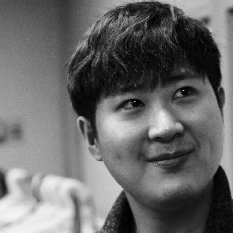 A grayscale headshot of Jerome Yoo.