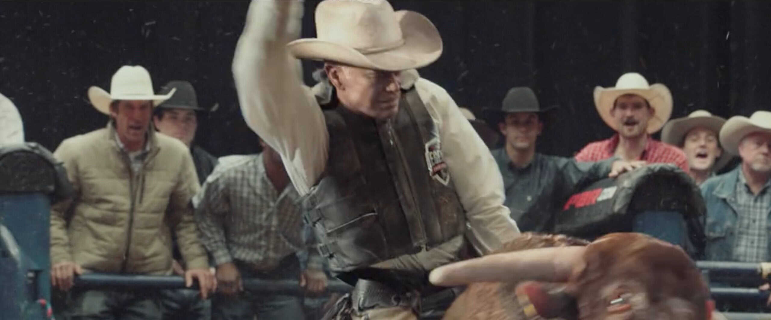 The Last Rodeo A man in cowboy gear riding a bull